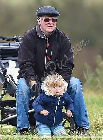 mischievous Mia Tindall plays with elderly family friend