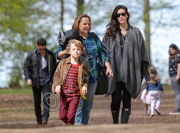 Liv Tyler walking at Badbury Clump with Dave Gardner's son with Dave Gardner in background Gray