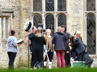 Aidan Turner and crew members in front of Chavenage House