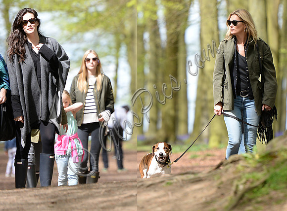 Supermodel Kate Moss wearing military style jacket, skinny jeans and cowboy boots takes a walk with her dog Archie and Liv Tyler who looked cool wearing a poncho teamed with Hunter wellies